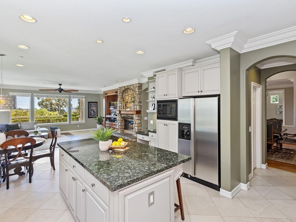 602 West Bluff Court Encinitas, CA 92024 - Photo 25 of 69 a kitchen with stainless steel appliances granite countertop a sink refrigerator and cabinets