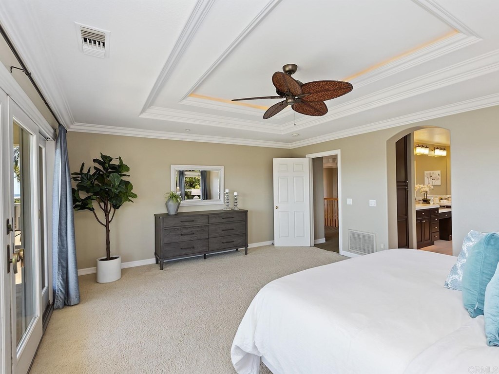 602 West Bluff Court Encinitas, CA 92024 - Photo 37 of 69 a bed room with furniture and a chandelier