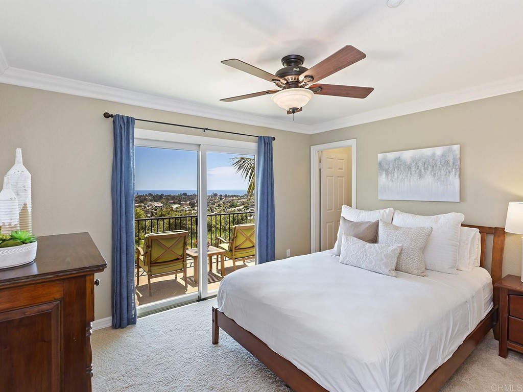 602 West Bluff Court Encinitas, CA 92024 - Photo 42 of 69 a bedroom with a large bed and a window