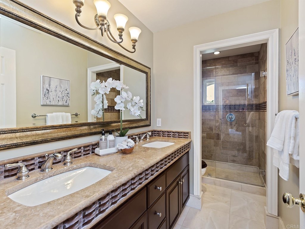 602 West Bluff Court Encinitas, CA 92024 - Photo 44 of 69 a bathroom with a sink double vanity and a mirror