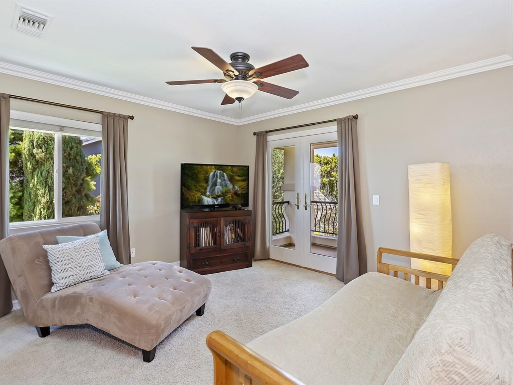 602 West Bluff Court Encinitas, CA 92024 - Photo 47 of 69 a bedroom with a bed flat screen tv and a couch