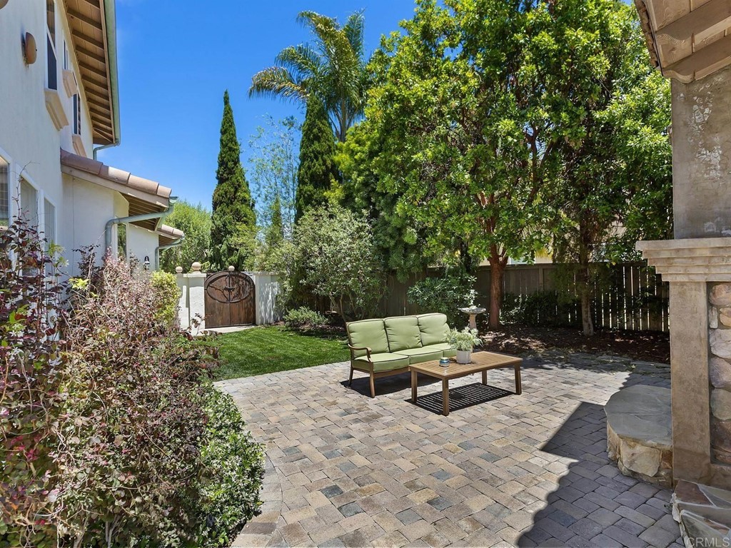 602 West Bluff Court Encinitas, CA 92024 - Photo 60 of 69 a view of a chair and table in backyard of the house