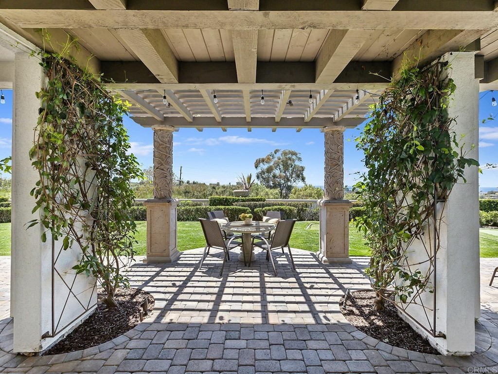 602 West Bluff Court Encinitas, CA 92024 - Photo 63 of 69 a view of a patio with table and chairs and potted plants
