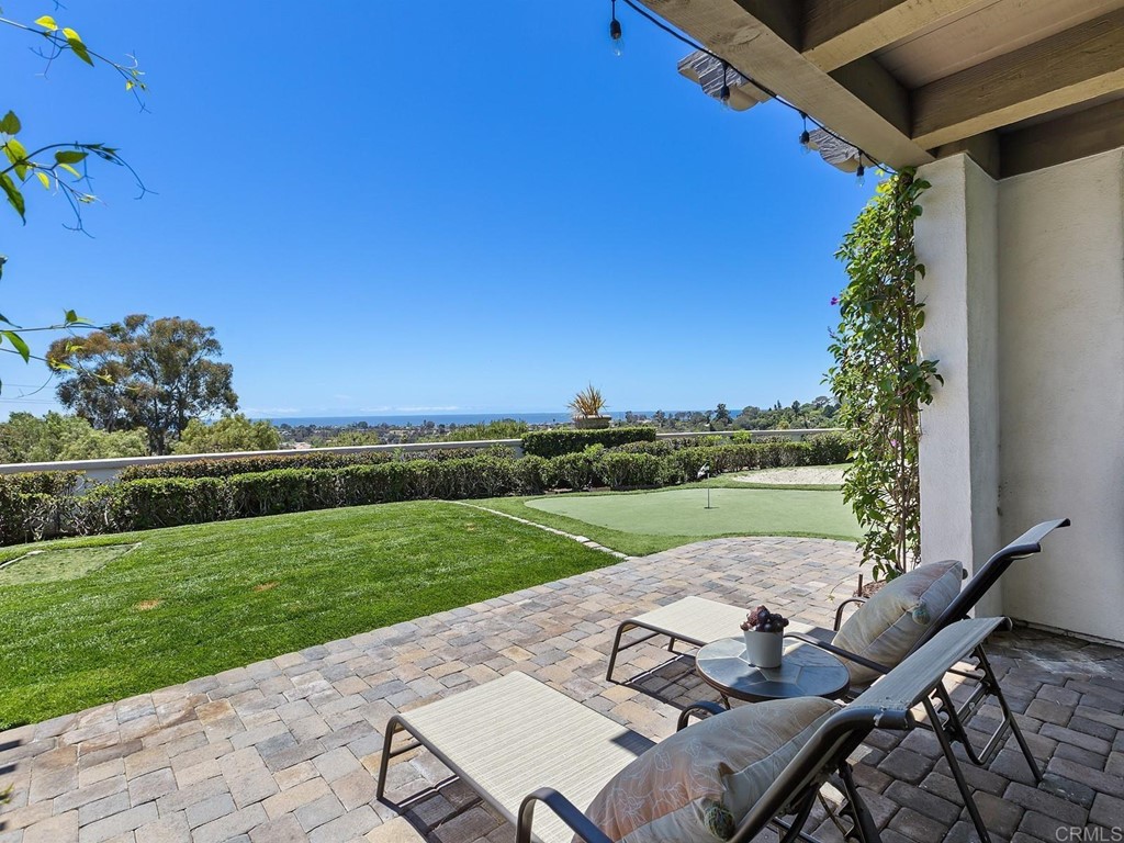 602 West Bluff Court Encinitas, CA 92024 - Photo 64 of 69 a view of a patio with lawn chairs floor to ceiling window and yard