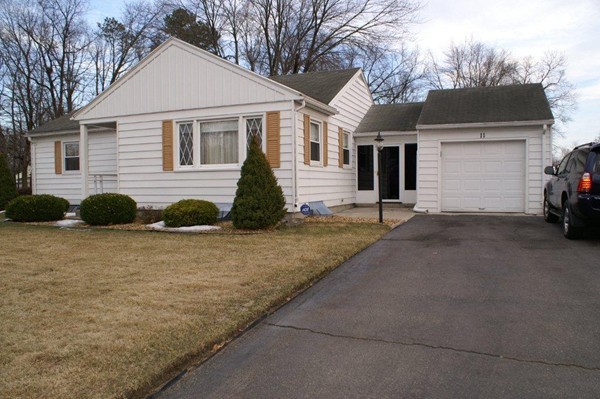11 Peer Street Springfield, MA 01109 - Photo 1 of 12 a view of a white house with a street view