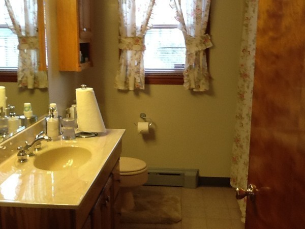 11 Peer Street Springfield, MA 01109 - Photo 12 of 12 a bathroom with a sink and a mirror