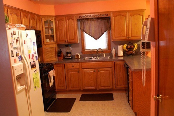 11 Peer Street Springfield, MA 01109 - Photo 8 of 12 a kitchen with stainless steel appliances a refrigerator and a stove