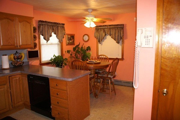 11 Peer Street Springfield, MA 01109 - Photo 9 of 12 a kitchen with a table and chairs in it