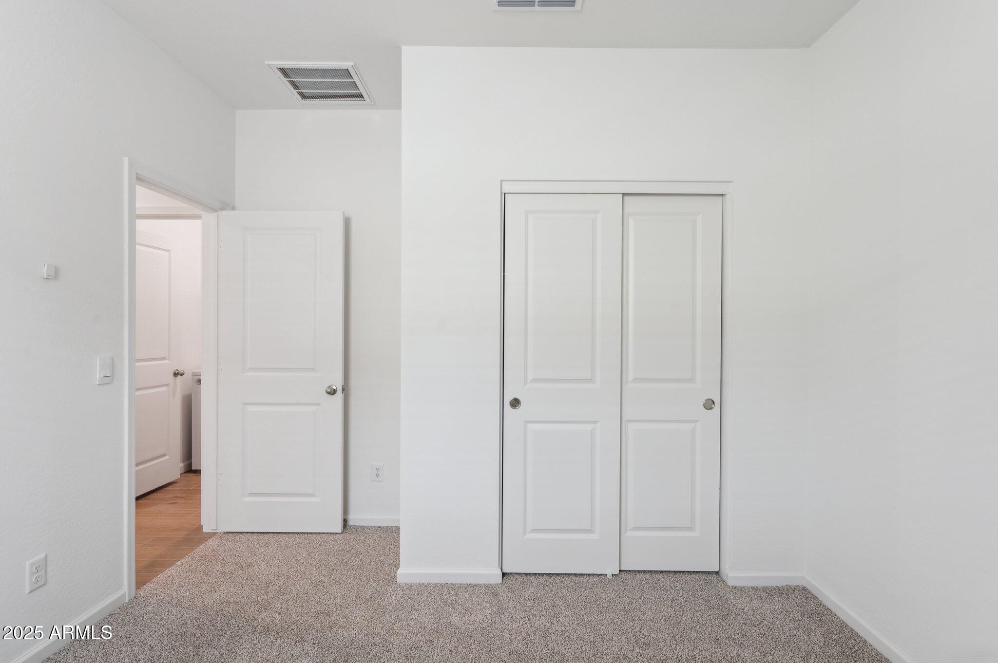 25464 West Fraktur Road Buckeye, AZ 85326 - Photo 13 of 19 a view of an empty room