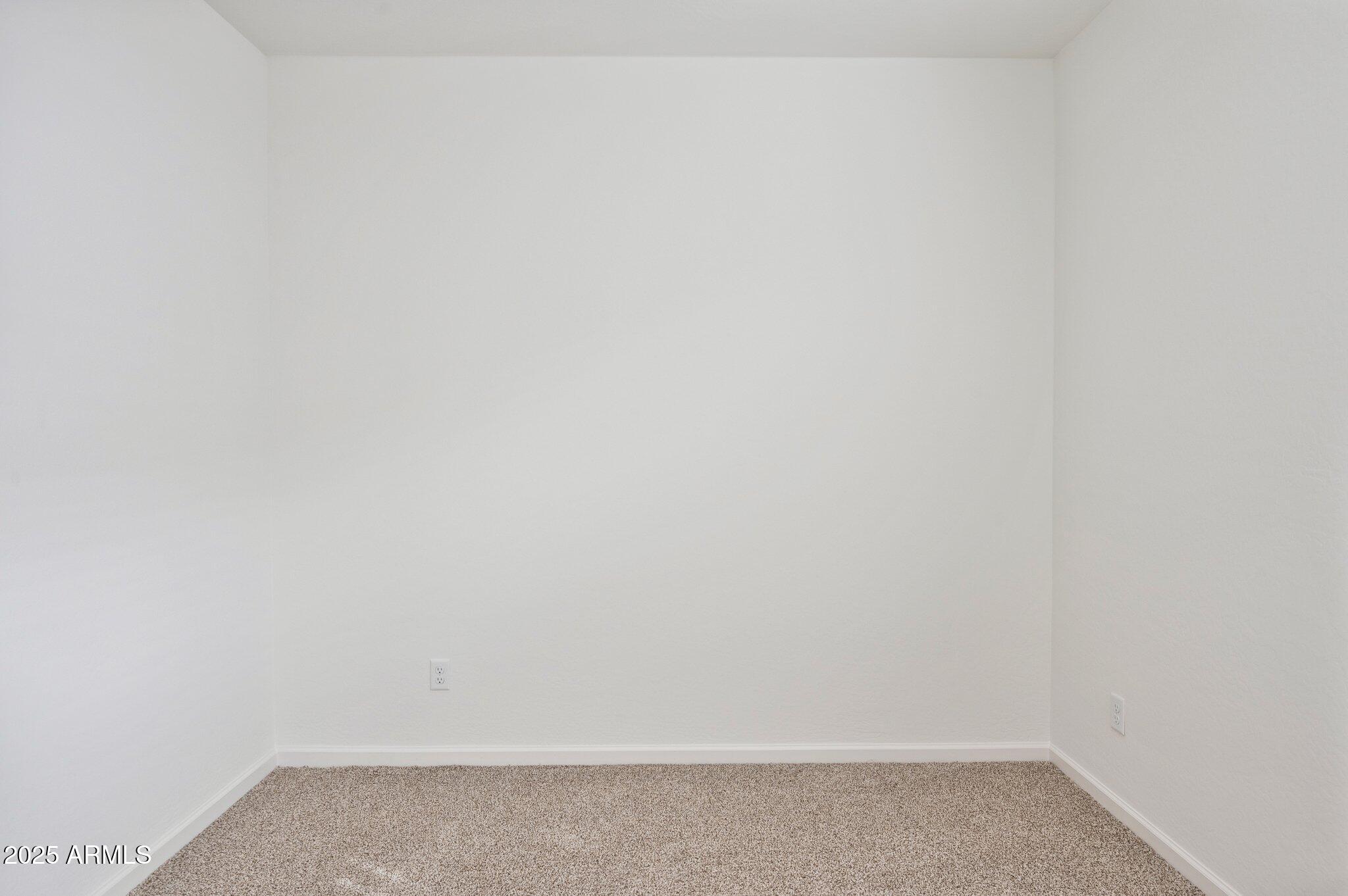 25464 West Fraktur Road Buckeye, AZ 85326 - Photo 14 of 19 a small space with a white wall