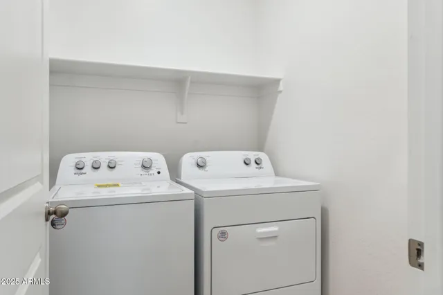 a utility room with dryer and washer