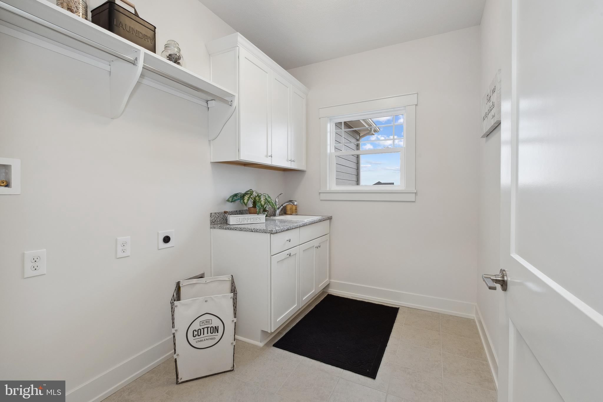 510 Newcomen Road, Unit M1D Exton, PA 19341 - Photo 27 of 34 a utility room with sink dryer and washer