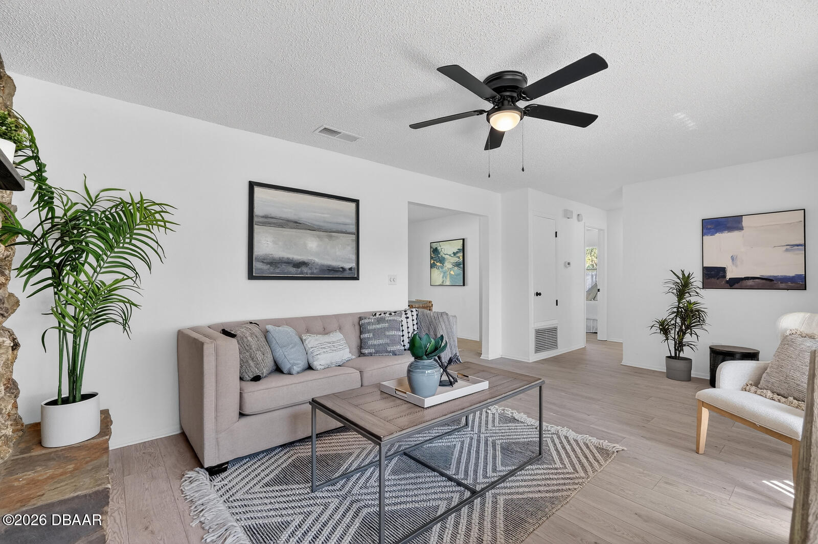 1147 Harms Way Port Orange, FL 32129 - Photo 11 of 38 a living room with furniture and a potted plant
