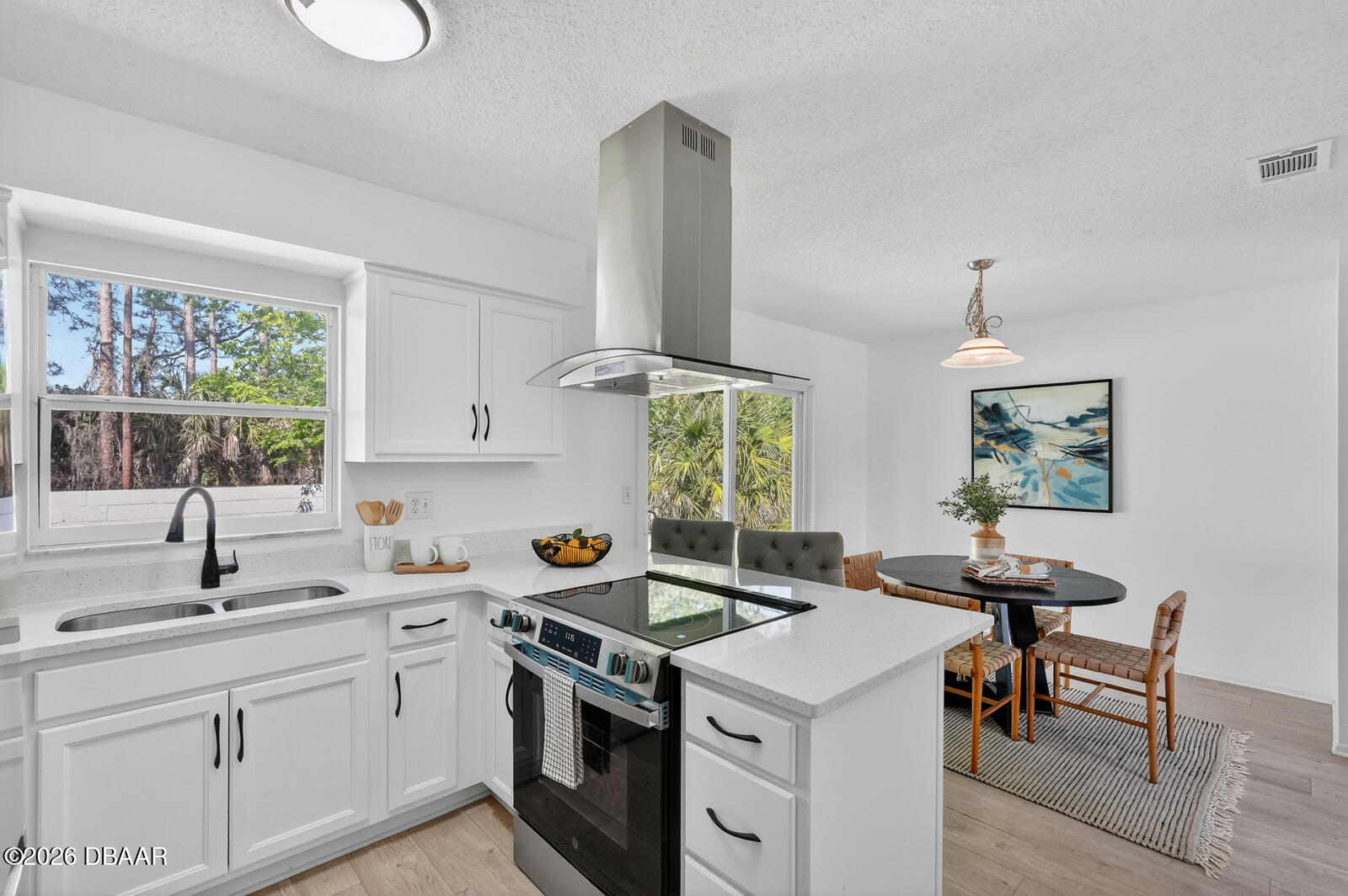 1147 Harms Way Port Orange, FL 32129 - Photo 16 of 38 a kitchen that has a sink a stove and a table