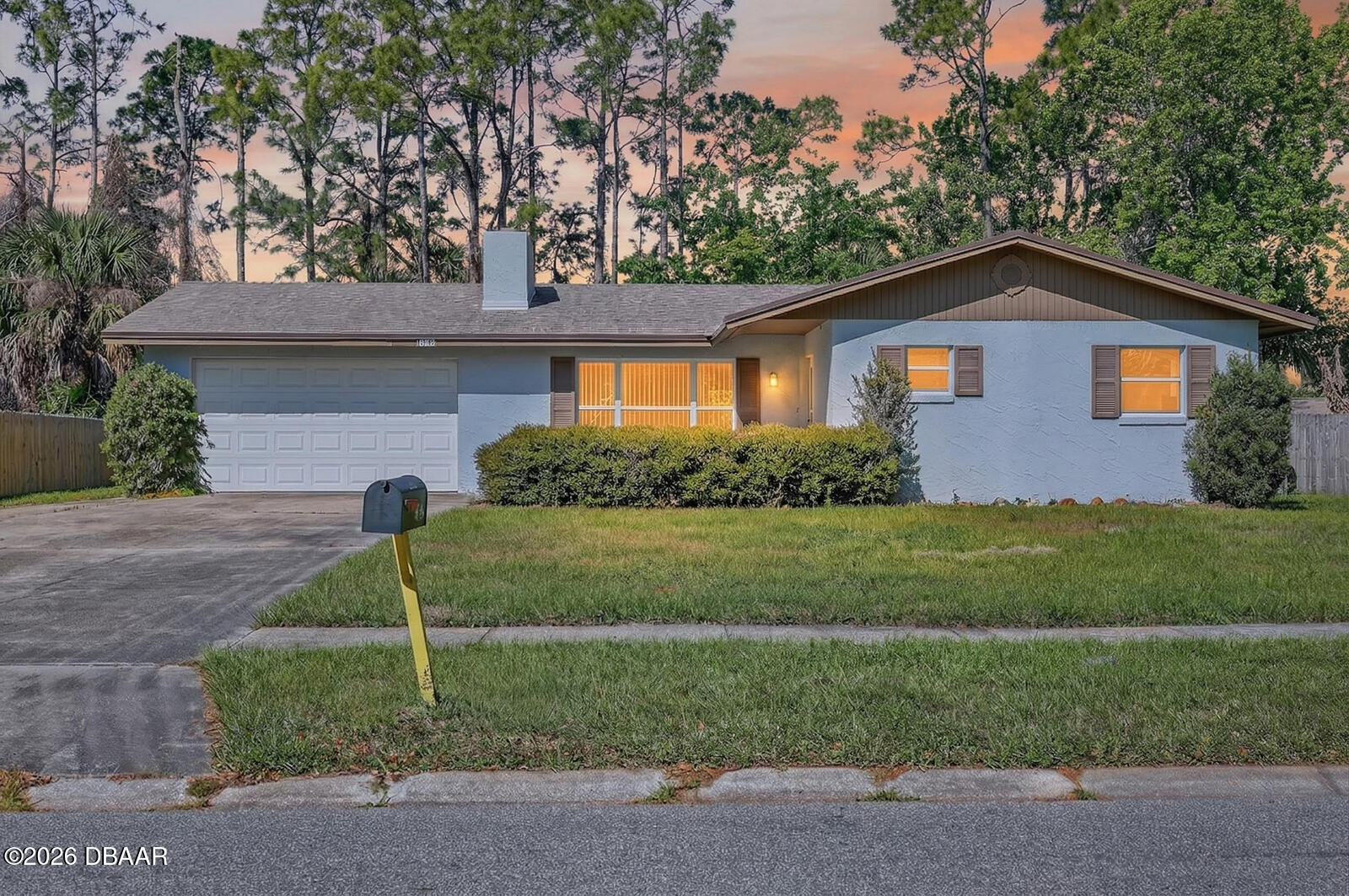 1147 Harms Way Port Orange, FL 32129 - Photo 2 of 38 a front view of a house with a yard