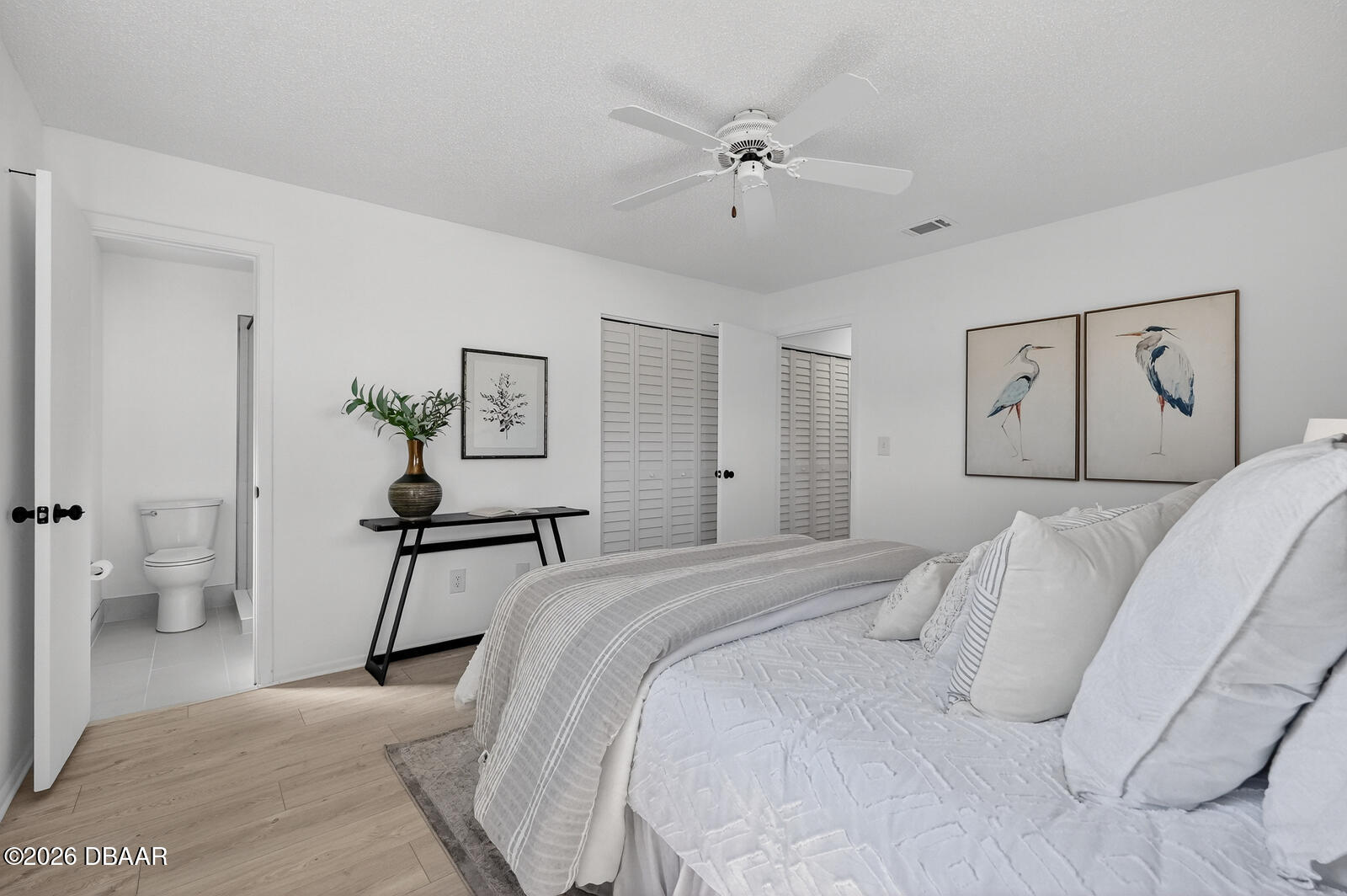 1147 Harms Way Port Orange, FL 32129 - Photo 23 of 38 a bedroom with a large bed and a chandelier