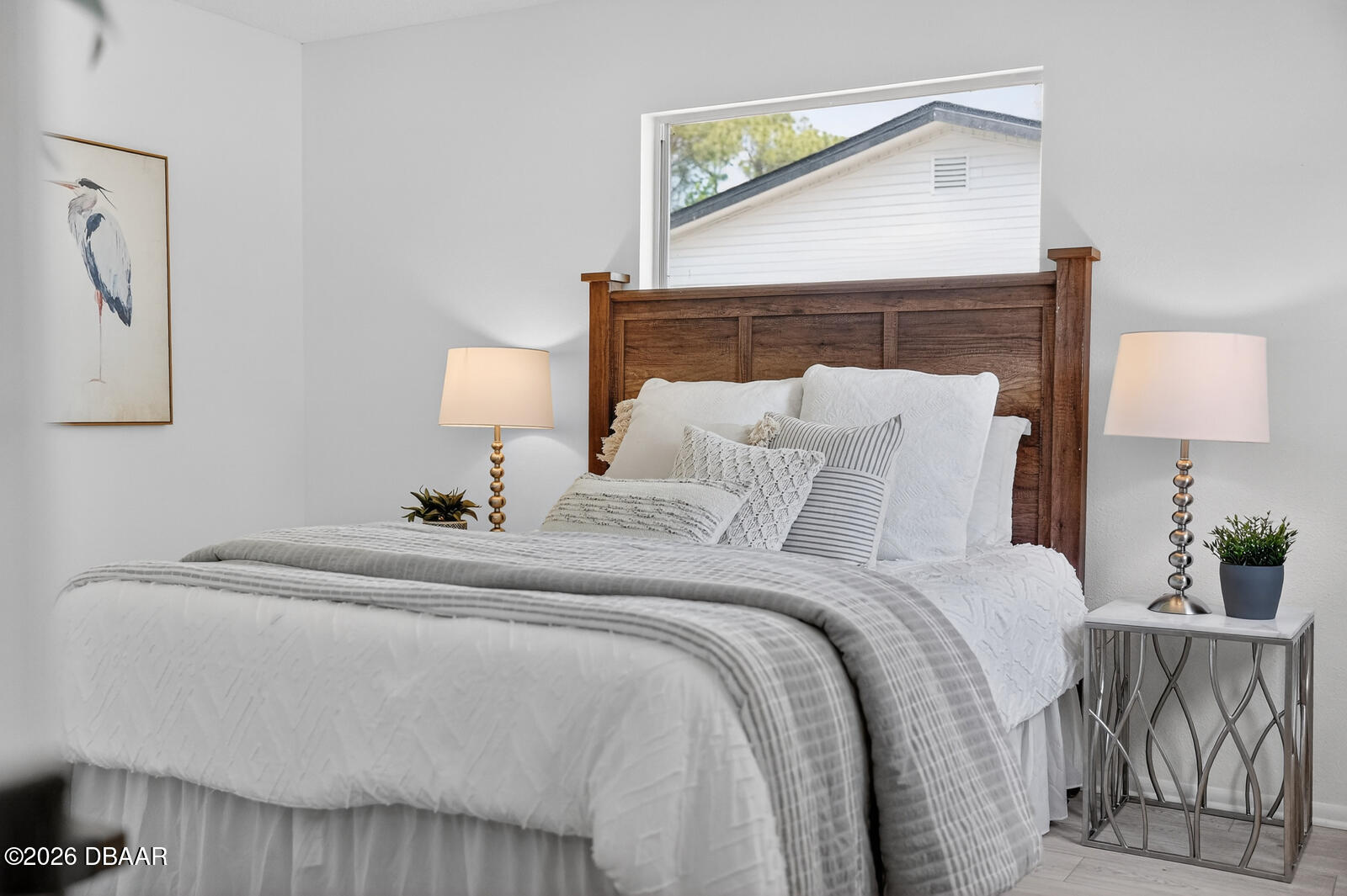 1147 Harms Way Port Orange, FL 32129 - Photo 24 of 38 a bedroom with a bed and a lamp on dresser