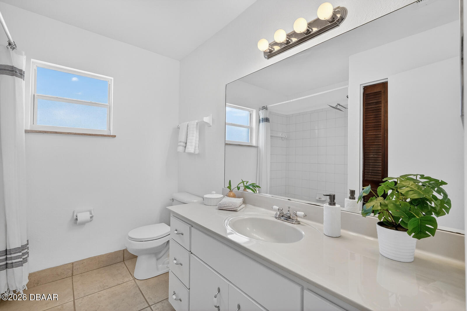 1147 Harms Way Port Orange, FL 32129 - Photo 25 of 38 a bathroom with a sink a toilet and a mirror