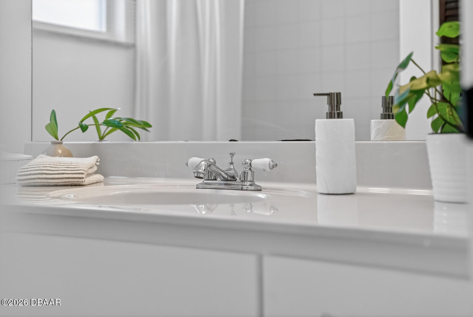 1147 Harms Way Port Orange, FL 32129 - Photo 26 of 38 a bathroom with a sink a vanity and a bathtub