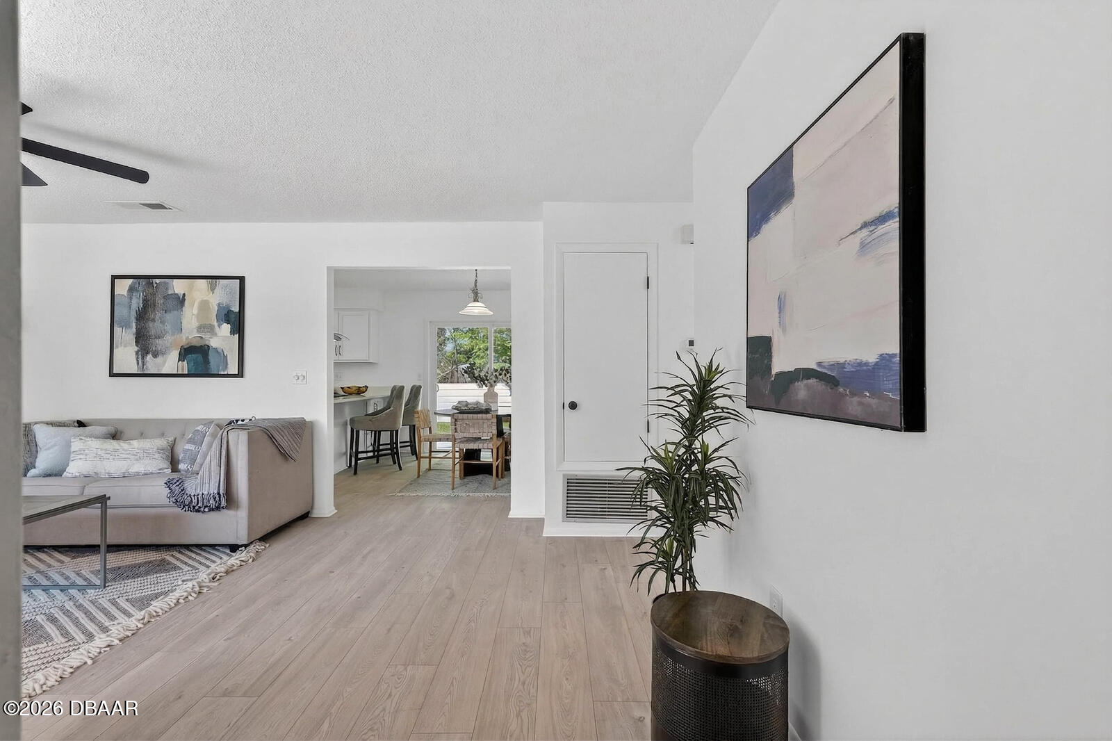 1147 Harms Way Port Orange, FL 32129 - Photo 5 of 38 a living room with furniture and a potted plant