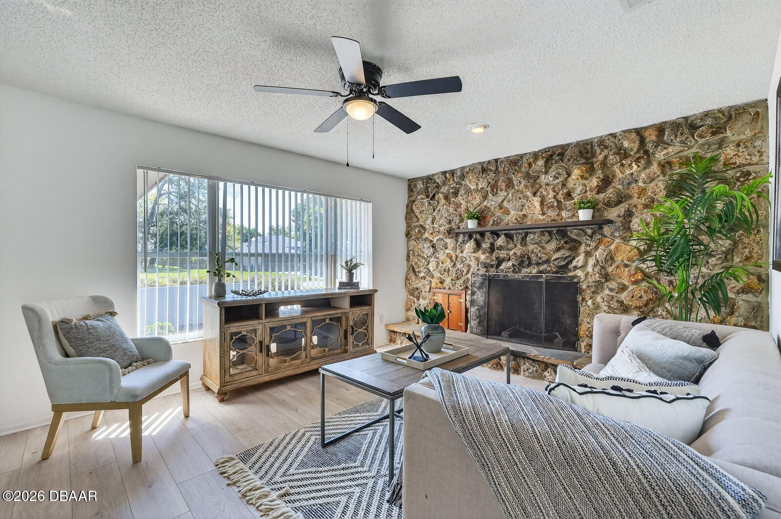 1147 Harms Way Port Orange, FL 32129 - Photo 8 of 38 a living room with furniture and a floor to ceiling window