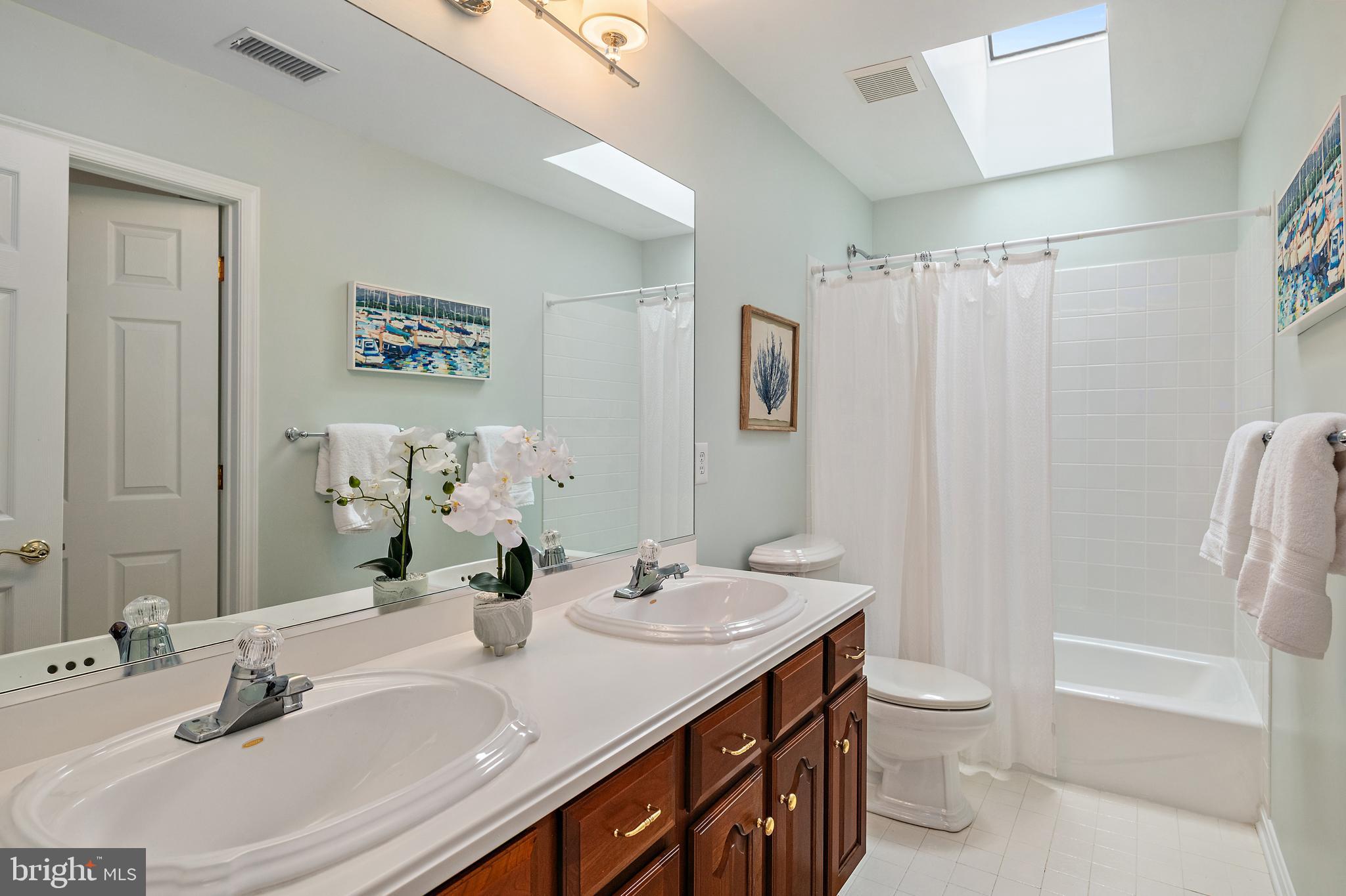 150 South River Landing Road Edgewater, MD 21037 - Photo 35 of 50 a bathroom with a double vanity sink toilet and shower