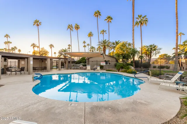 a view of a swimming pool with a patio