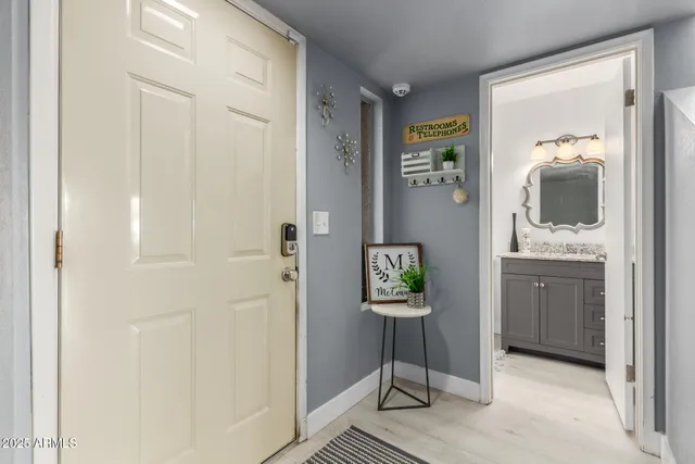 a view of a patio with table and chairs with wooden floor