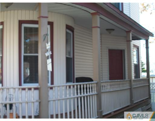 176 Rector Street Perth Amboy, NJ 08861 - Photo 2 of 24 a view of a house with a porch