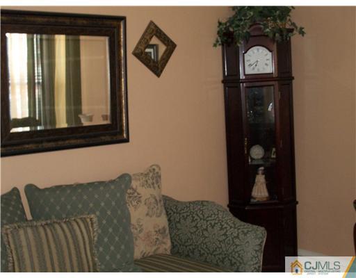 176 Rector Street Perth Amboy, NJ 08861 - Photo 11 of 24 a living room with a couch and a table