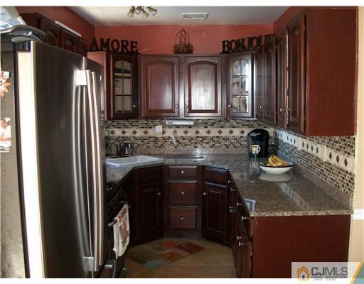 176 Rector Street Perth Amboy, NJ 08861 - Photo 4 of 24 a bathroom with a sink and a mirror