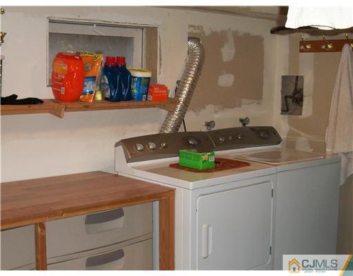 176 Rector Street Perth Amboy, NJ 08861 - Photo 6 of 24 a bathroom with a sink and a mirror