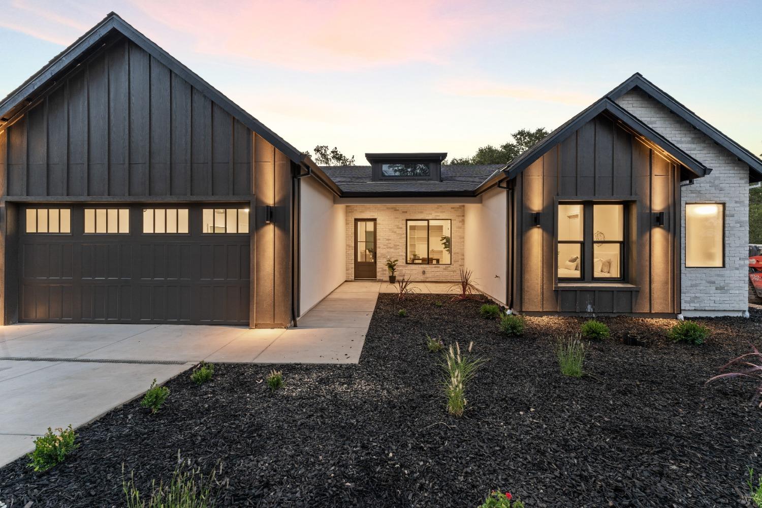 a view of house with backyard