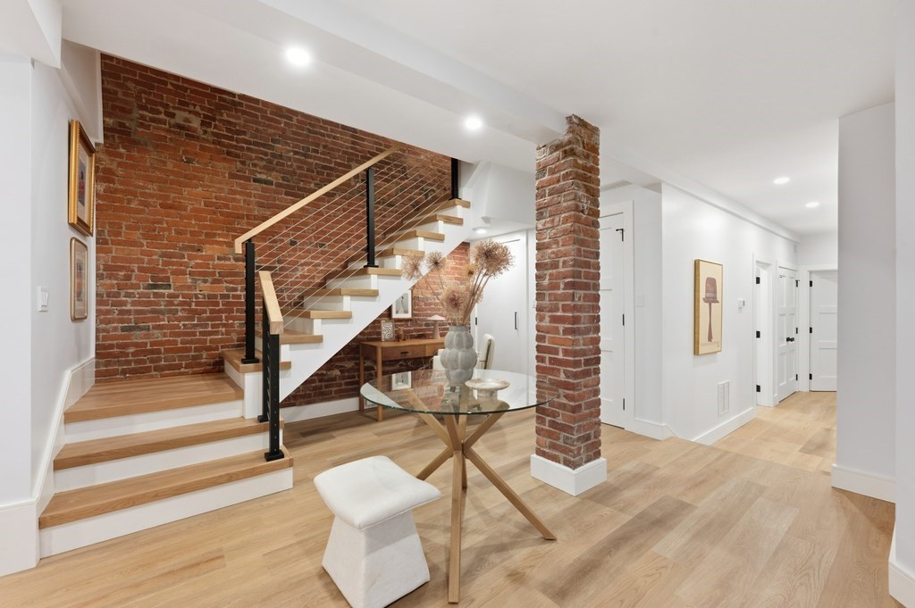 94 St Botolph Street, Unit 1 Boston, MA 02116 - Photo 13 of 37 a view of entryway with wooden floor and stairs