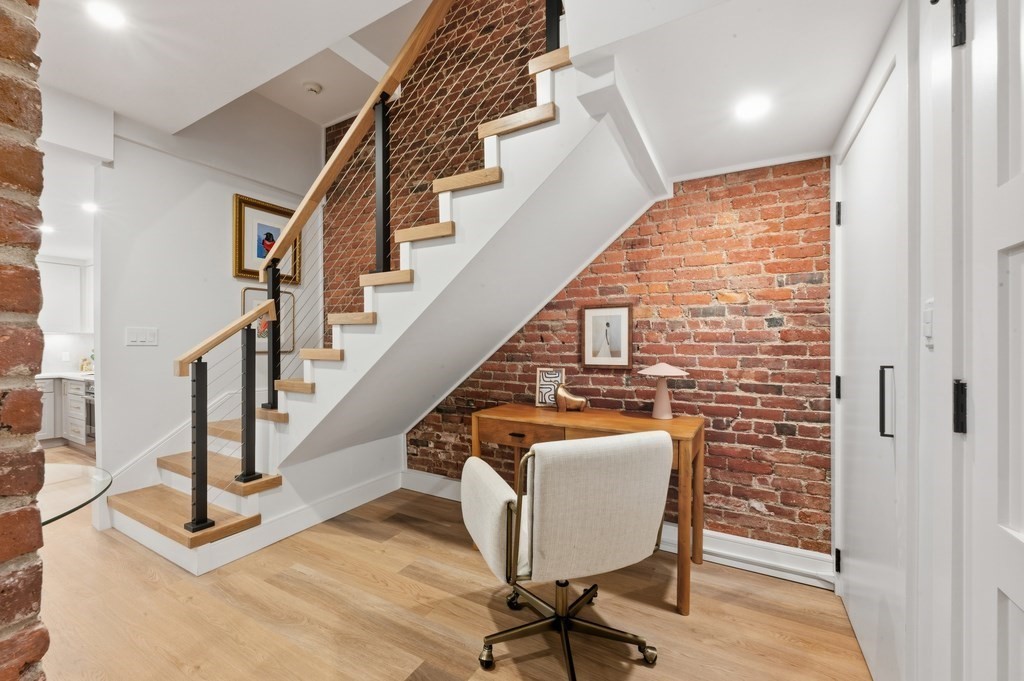 94 St Botolph Street, Unit 1 Boston, MA 02116 - Photo 17 of 37 a view of entryway with wooden floor and stairs