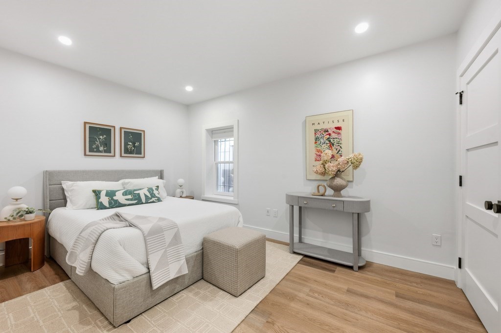 94 St Botolph Street, Unit 1 Boston, MA 02116 - Photo 18 of 37 a bedroom with a bed and a table