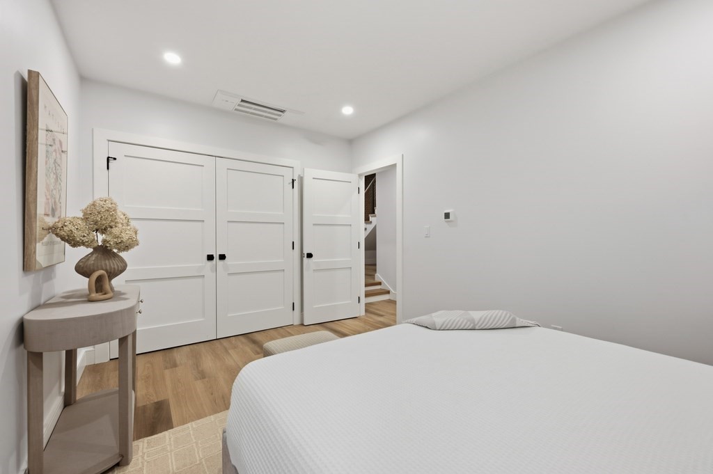 94 St Botolph Street, Unit 1 Boston, MA 02116 - Photo 20 of 37 a bedroom with a bed and a chandelier