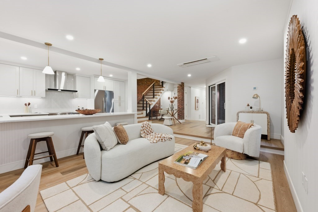 94 St Botolph Street, Unit 1 Boston, MA 02116 - Photo 2 of 37 a living room with furniture and kitchen view