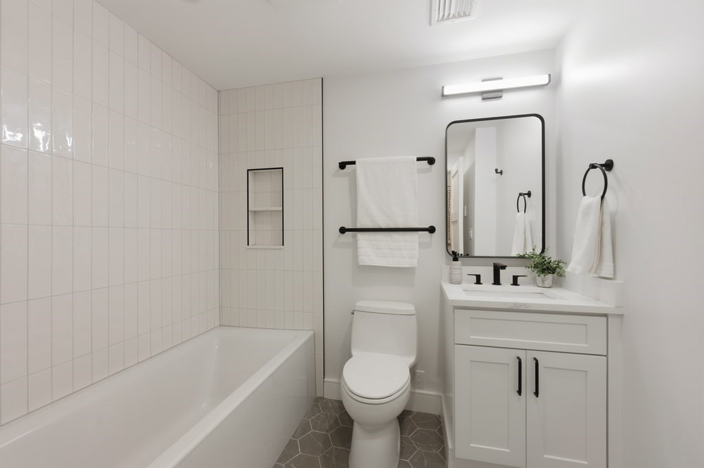 94 St Botolph Street, Unit 1 Boston, MA 02116 - Photo 22 of 37 a bathroom with a sink toilet and shower