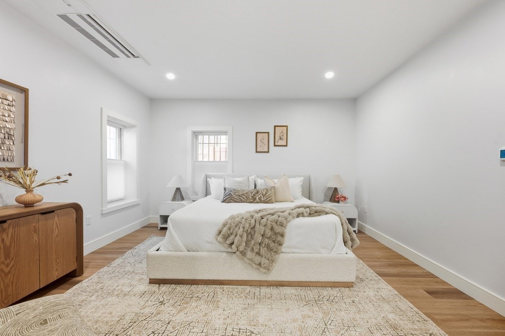 94 St Botolph Street, Unit 1 Boston, MA 02116 - Photo 24 of 37 a spacious bedroom with a bed and a couch