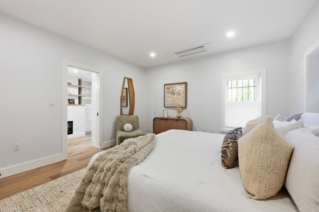 94 St Botolph Street, Unit 1 Boston, MA 02116 - Photo 25 of 37 a bedroom with a large bed and a chandelier
