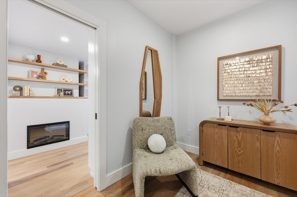 94 St Botolph Street, Unit 1 Boston, MA 02116 - Photo 26 of 37 a living room with furniture and a fireplace