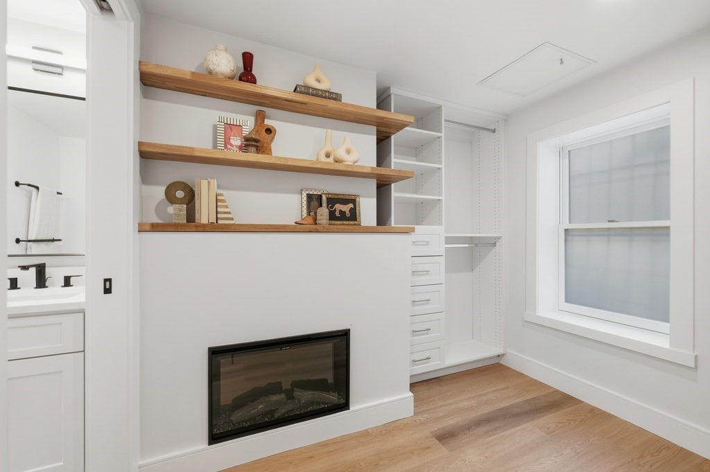 94 St Botolph Street, Unit 1 Boston, MA 02116 - Photo 27 of 37 a living room with furniture and a fireplace