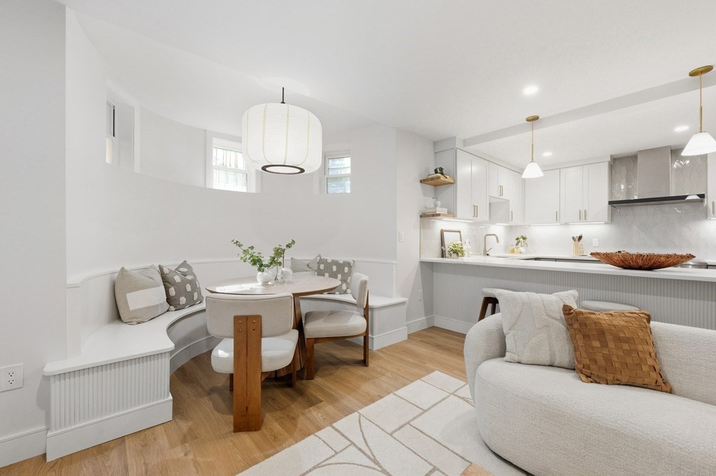 94 St Botolph Street, Unit 1 Boston, MA 02116 - Photo 3 of 37 a living room with furniture and a chandelier