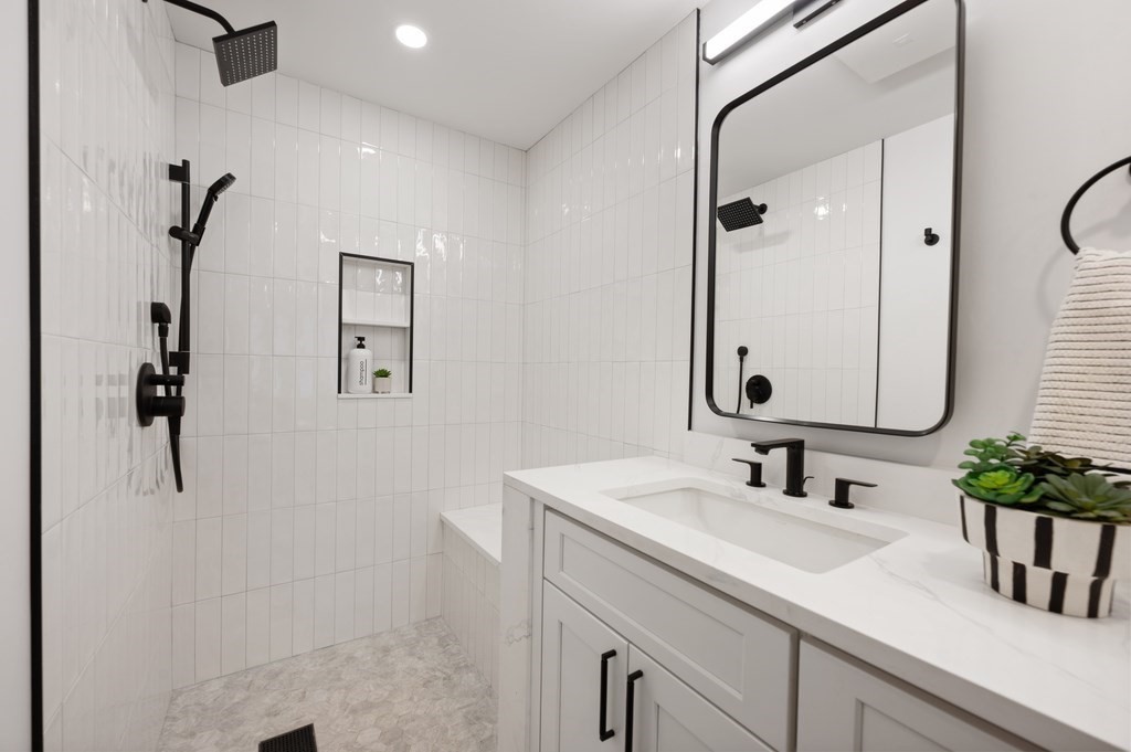 94 St Botolph Street, Unit 1 Boston, MA 02116 - Photo 31 of 37 a bathroom with a sink and a mirror
