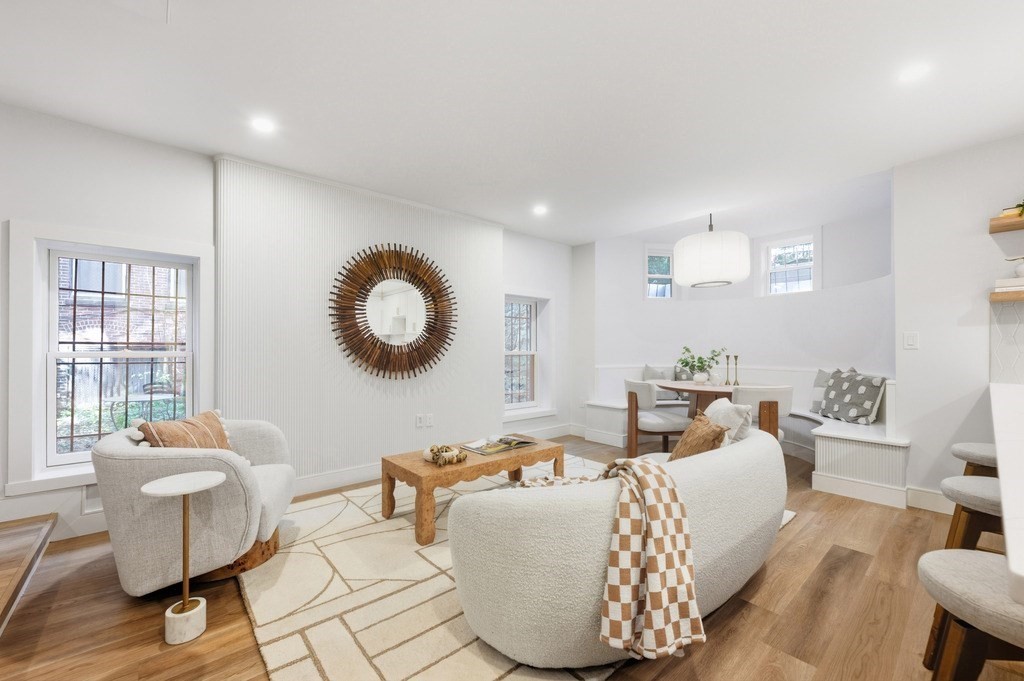 94 St Botolph Street, Unit 1 Boston, MA 02116 - Photo 5 of 37 a living room with furniture and a large window