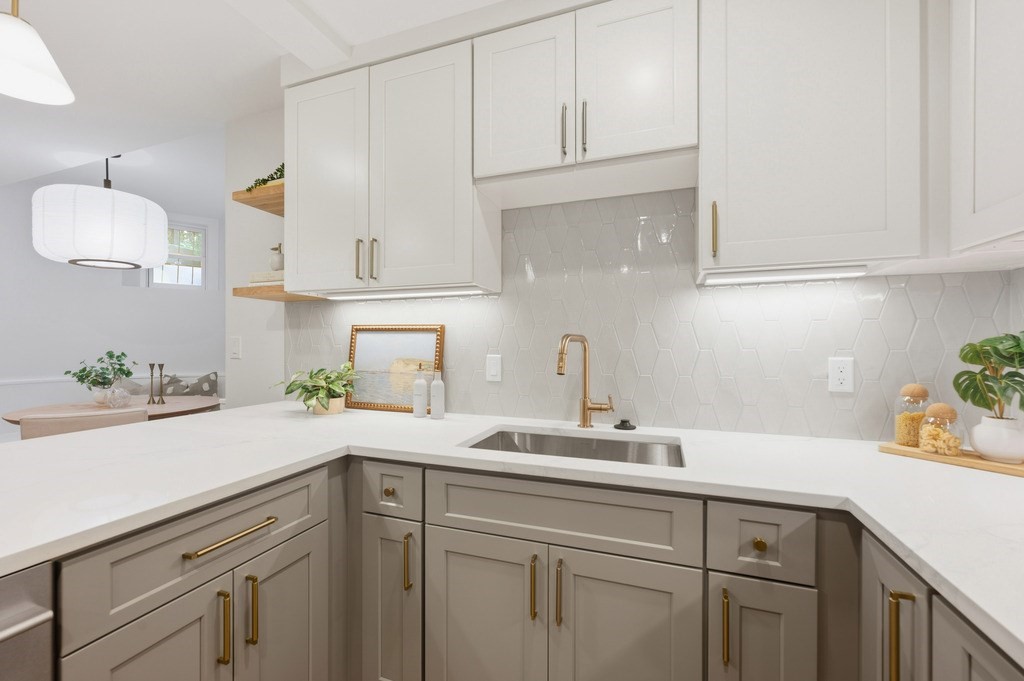 94 St Botolph Street, Unit 1 Boston, MA 02116 - Photo 8 of 37 a kitchen with white cabinets and a sink
