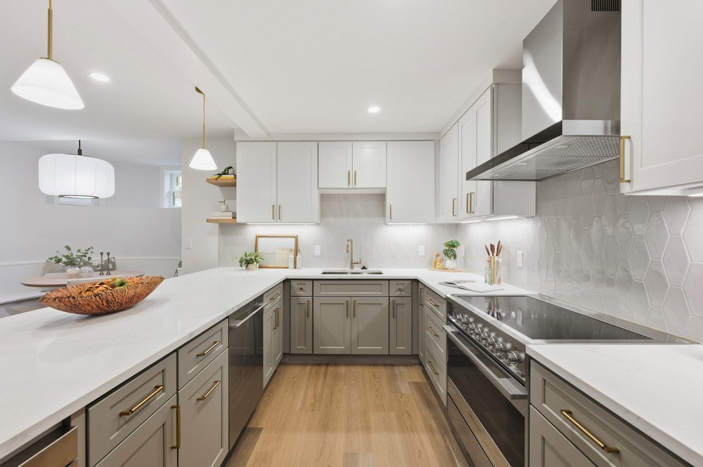 94 St Botolph Street, Unit 1 Boston, MA 02116 - Photo 9 of 37 a kitchen with a sink a stove and cabinets