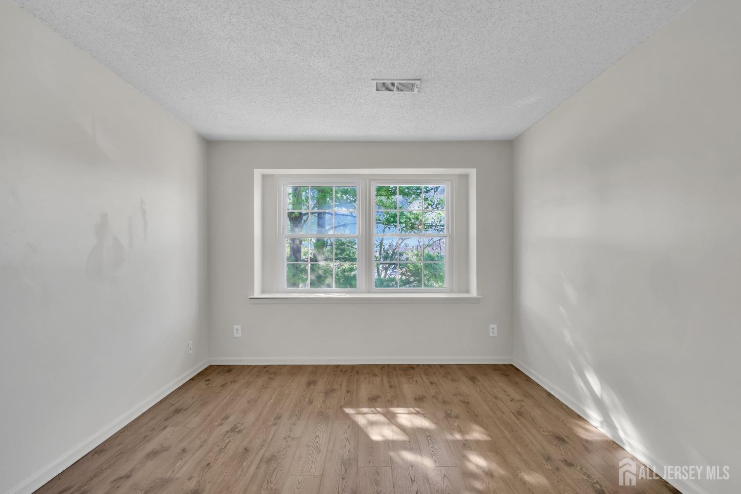 130 Edpas Road New Brunswick, NJ 08901 - Photo 9 of 18 an empty room with a window