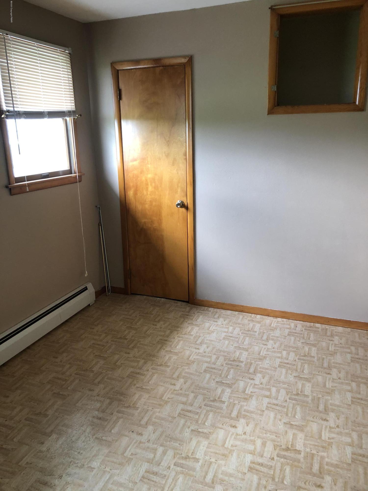 571 Spring Hill Road Moscow, PA 18444 - Photo 13 of 29 an empty room with windows